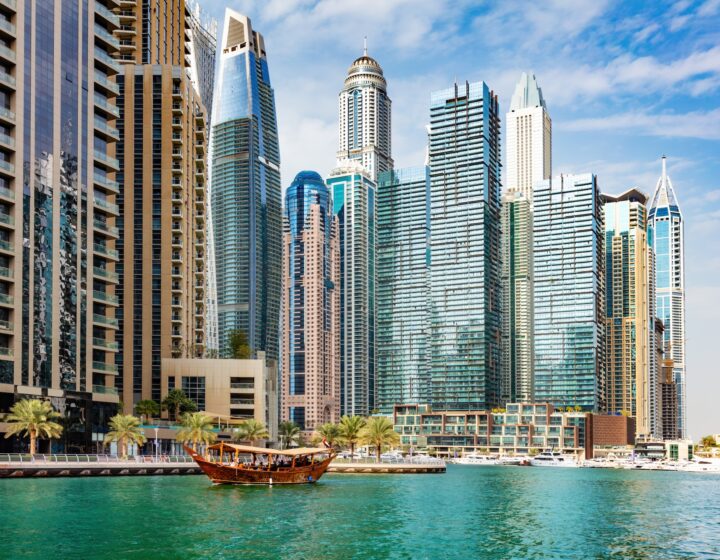 Dubai marina and tourist traditional boat in UAE